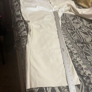 New Women flare leather dress pants. Small red stain can be cover w/blouse